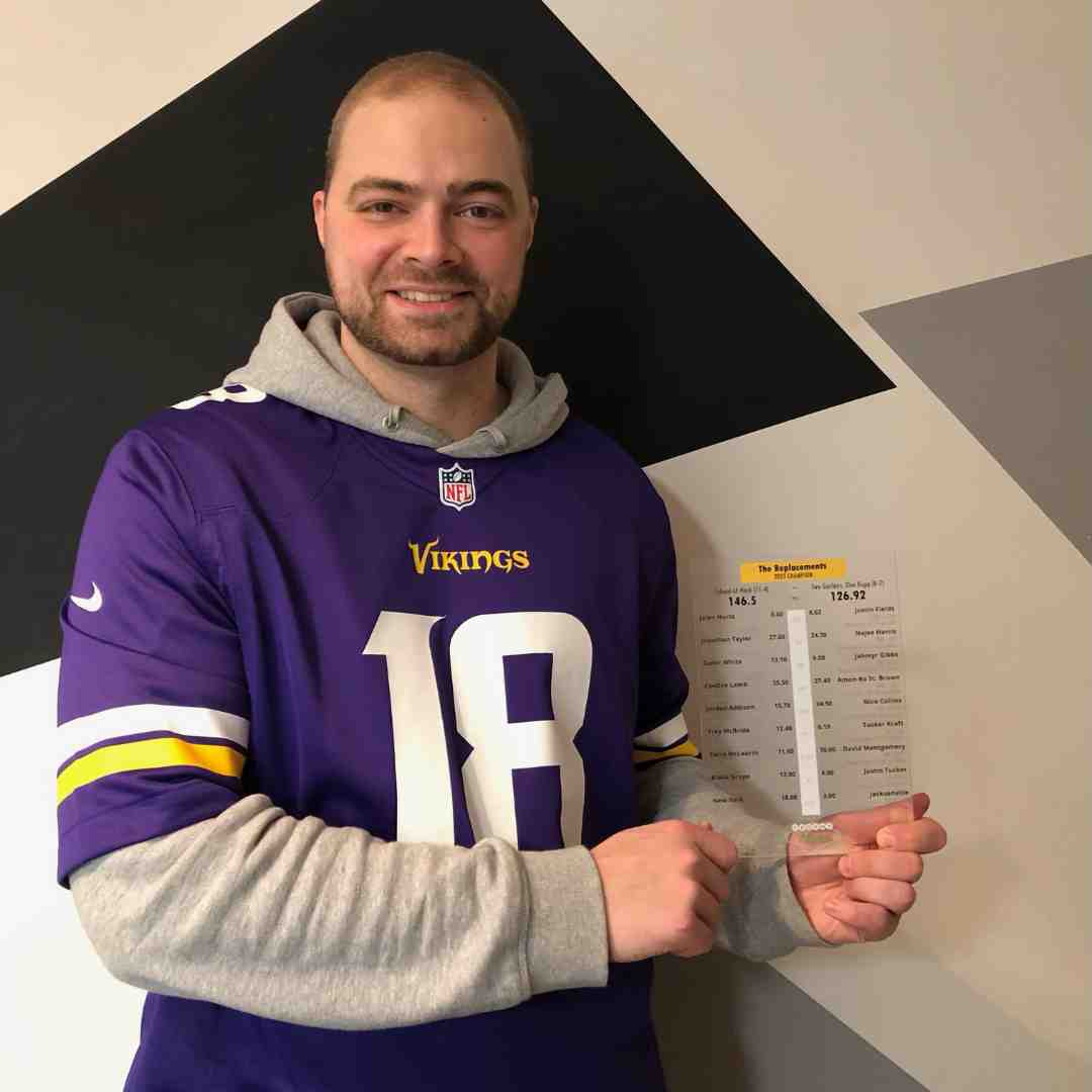 Customer with Fantasy Football Trophy